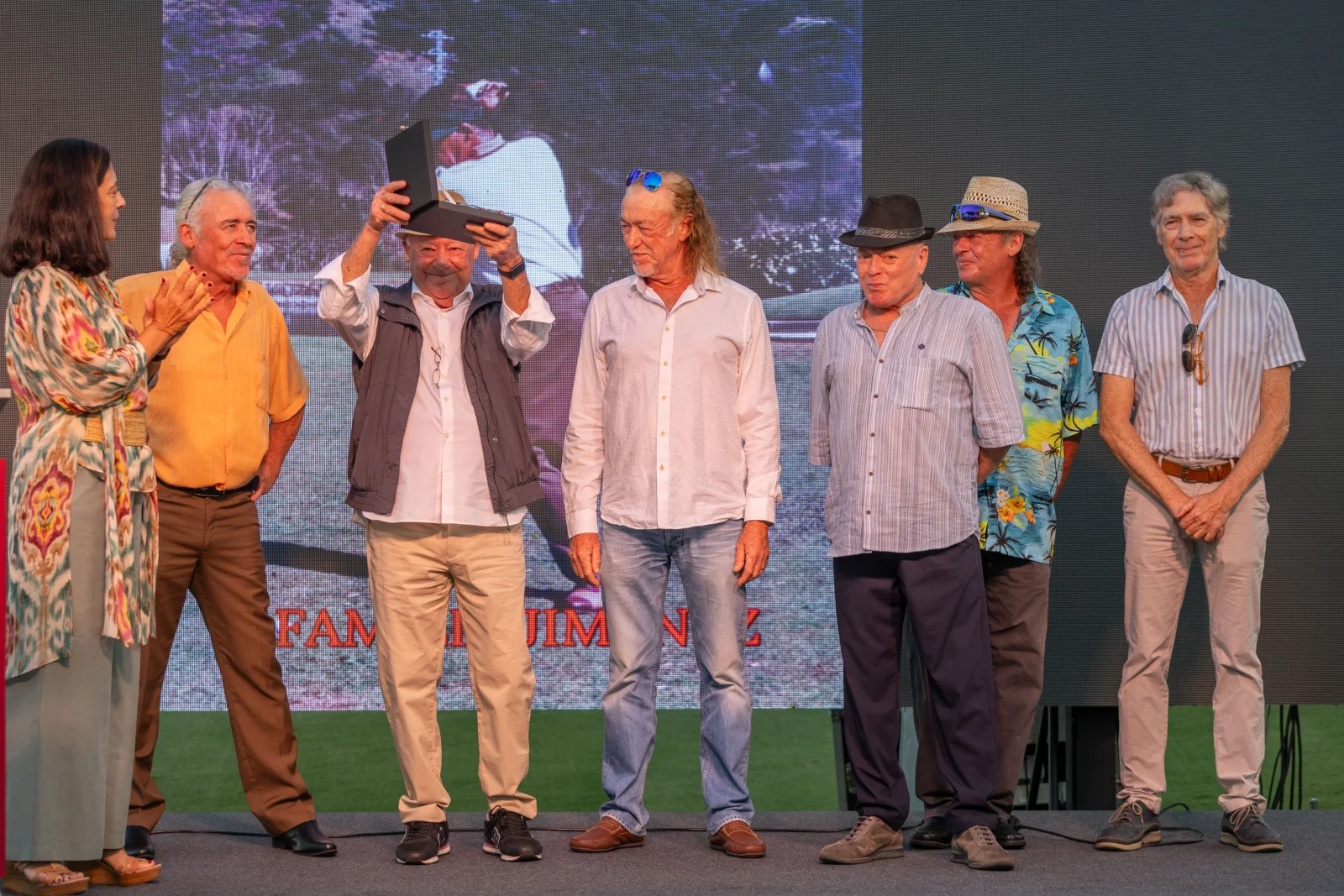 The Jiménez Rodríguez brothers receive the family tribute on stage during the Golf Torrequebrada 50th anniversary gala