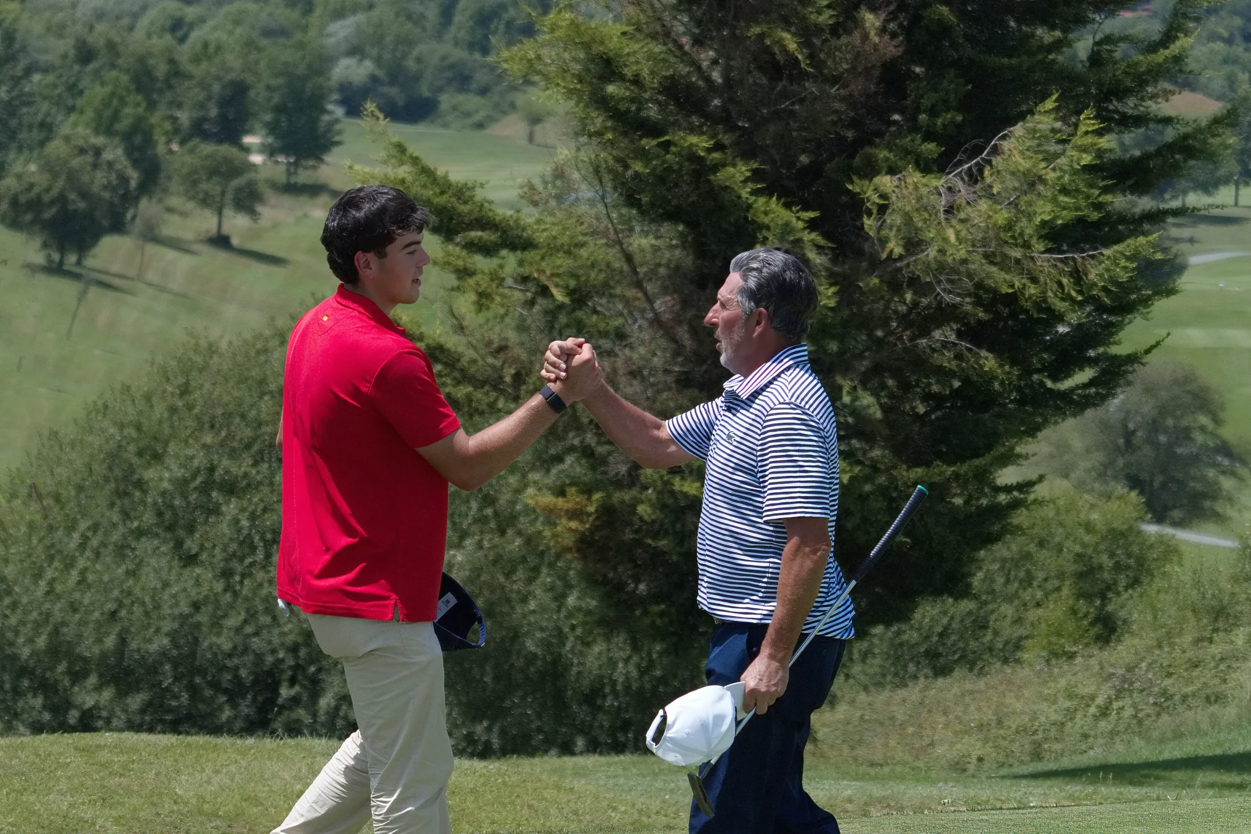 Joseba Torres greets his uncle José María Olazábal at the Bizkaia PGAe Open in Meaztegi